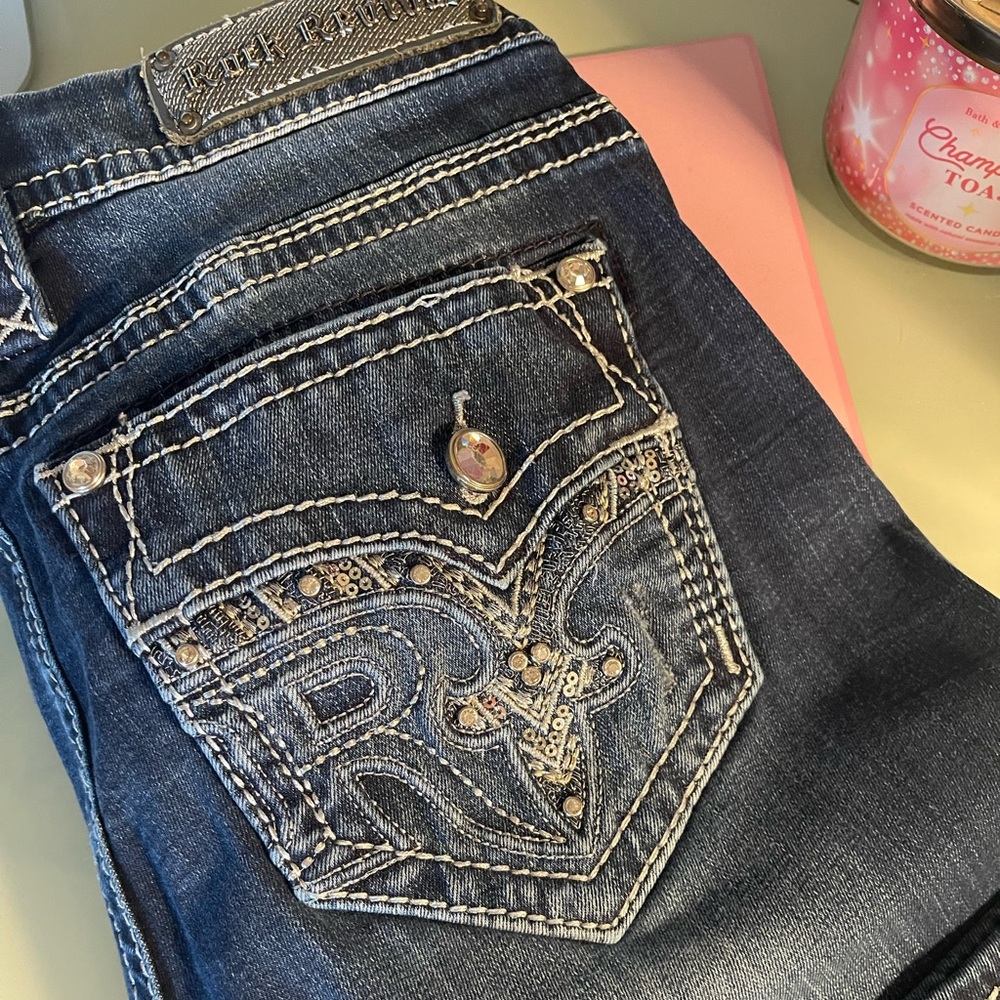 Rock Revival Dark Blue Mid rise Boot Cut Jeans with Embellished Pockets